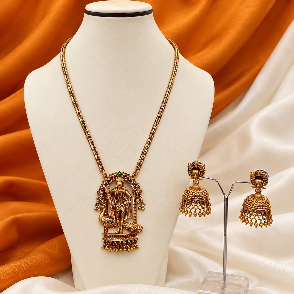 studio_product_photo_scene_a_well_lit_still_life.png Antique Gold Temple Deity Long Necklace & Jhumka Set