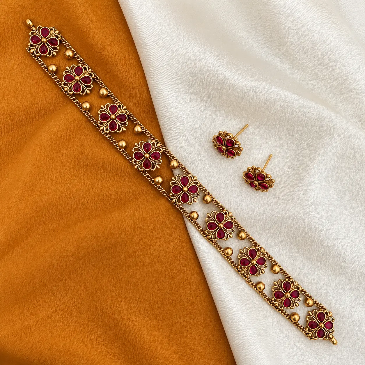a_high_resolution_studio_lit_flat_lay_photograph.png Antique Gold Tone Red Floral Choker Set with Stud Earrings