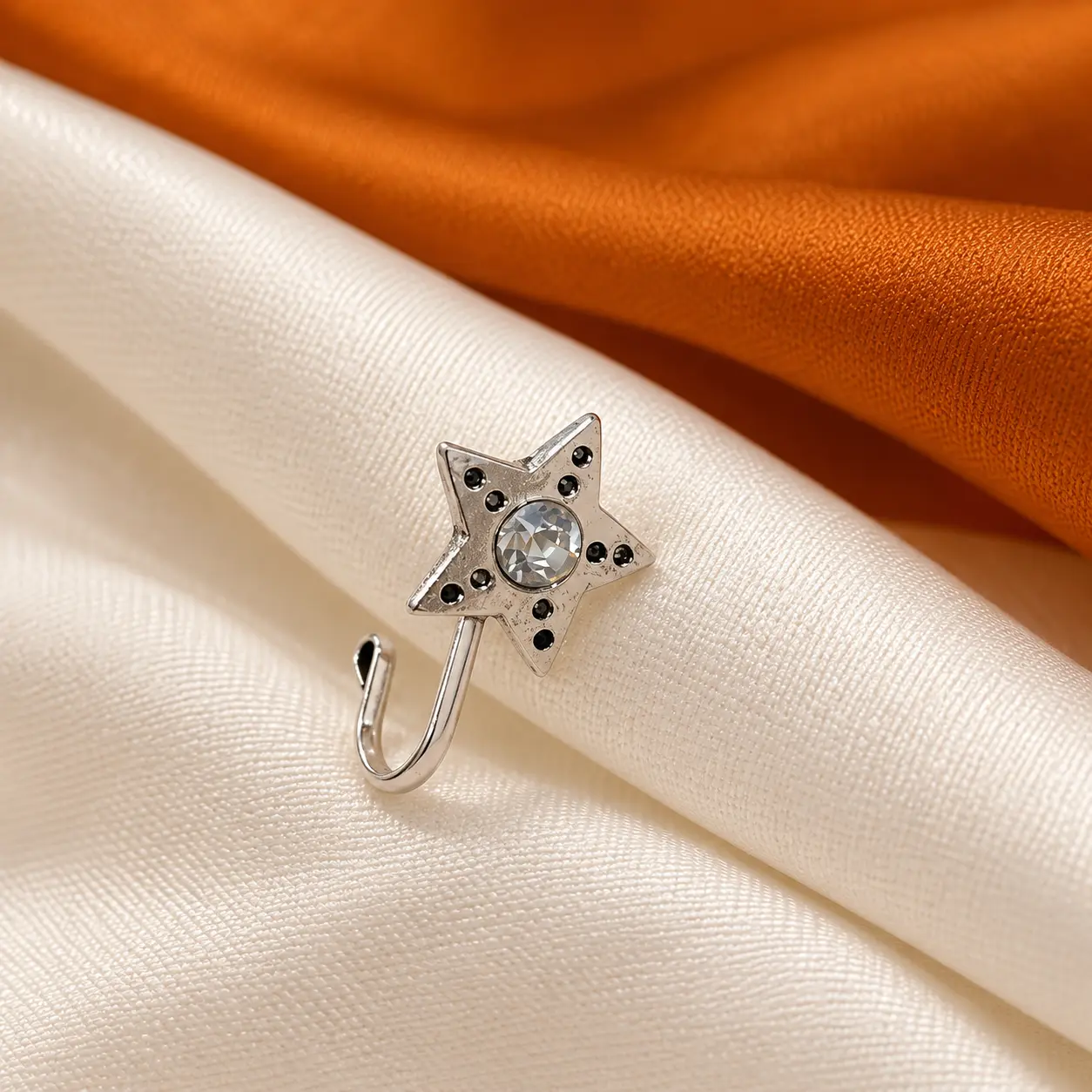 close_up_product_style_still_life_photograph._over.png Silver-Tone Star Nose Pin with Clear Centre Stone