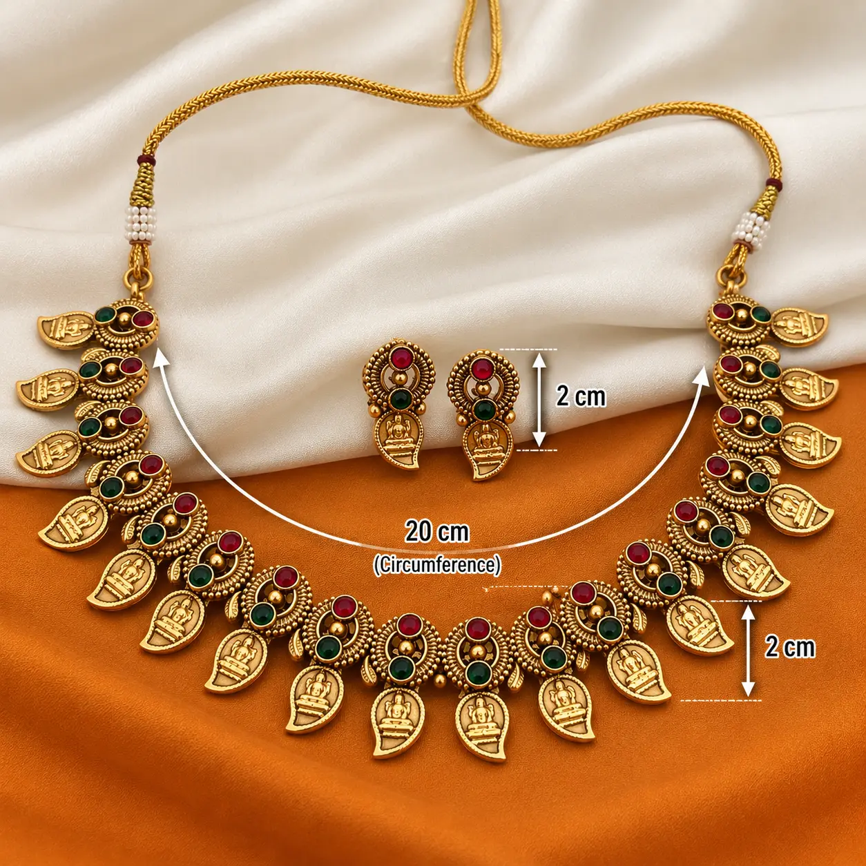 a_clean_product_photo_style_image_on_a_textile_bac.png Antique Gold Tone Temple Mango Necklace Set with Earrings – image 3